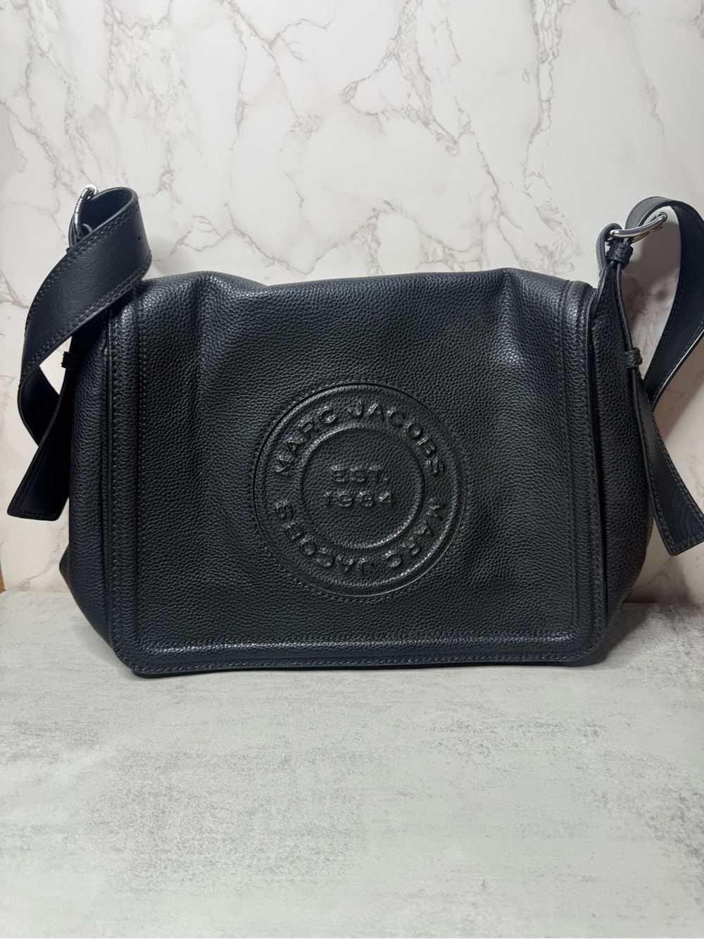 Marc Jacobs Black Pebbled Leather Messenger Bag with Embossed Round Logo